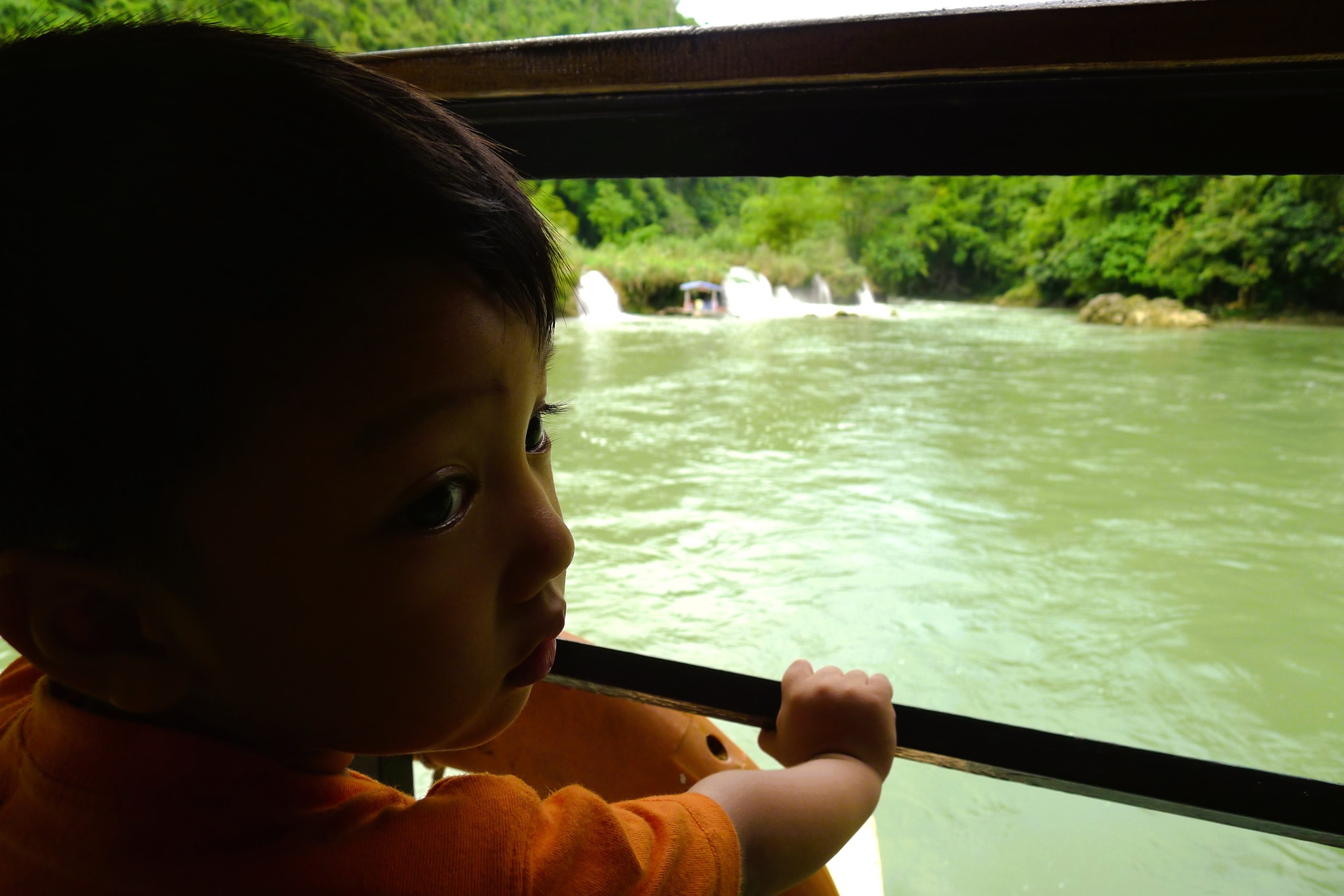 Young Filipino boy looking at the Bohol River 