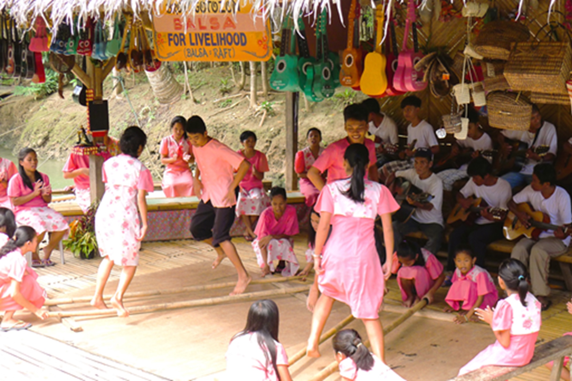 Filipino dance "Tinikling" by Bohol children being done by the banks of the Bohol river